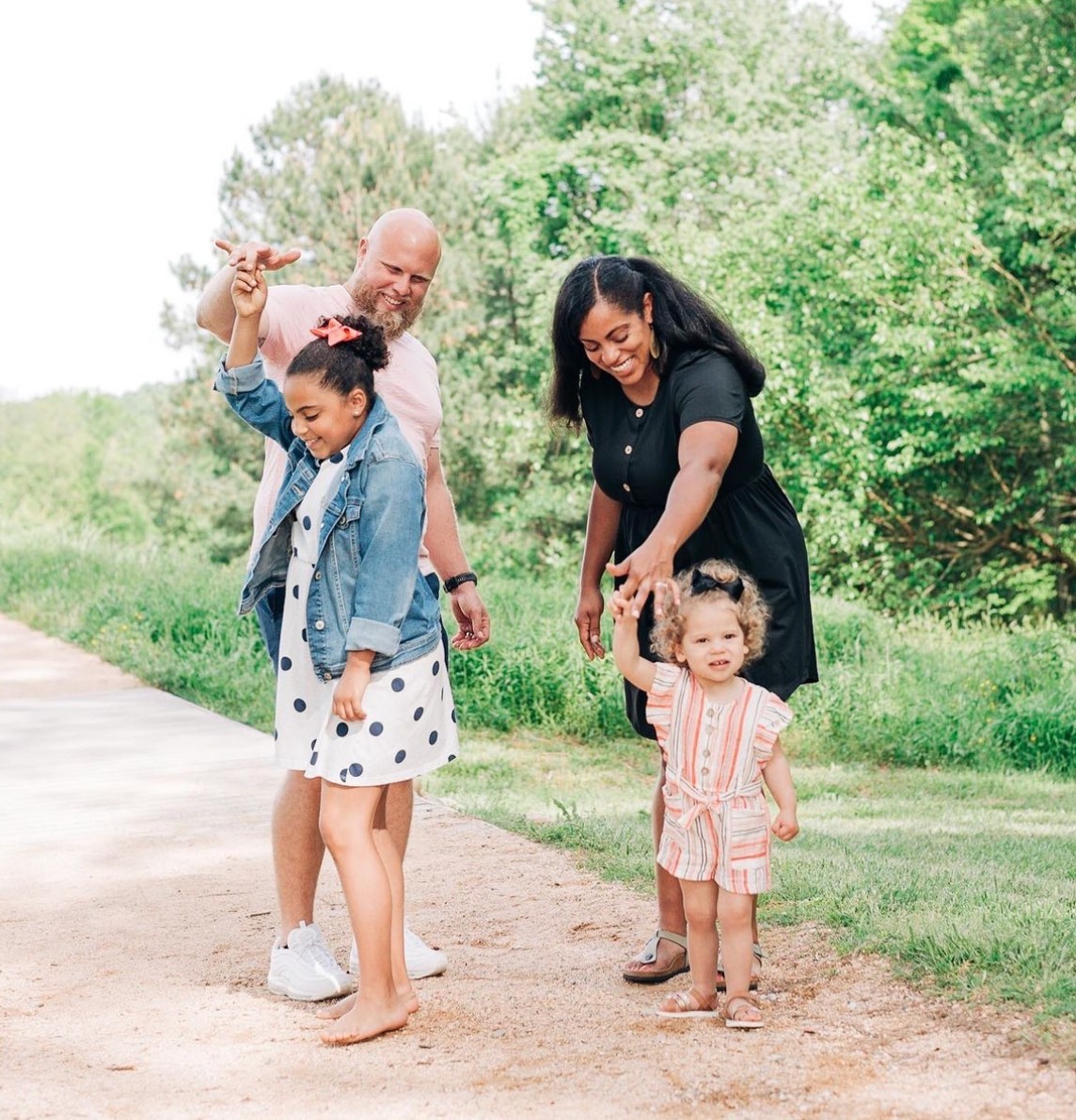 Tyler and Brittany Mosko with their daughters on a walk near the Triangle, NC